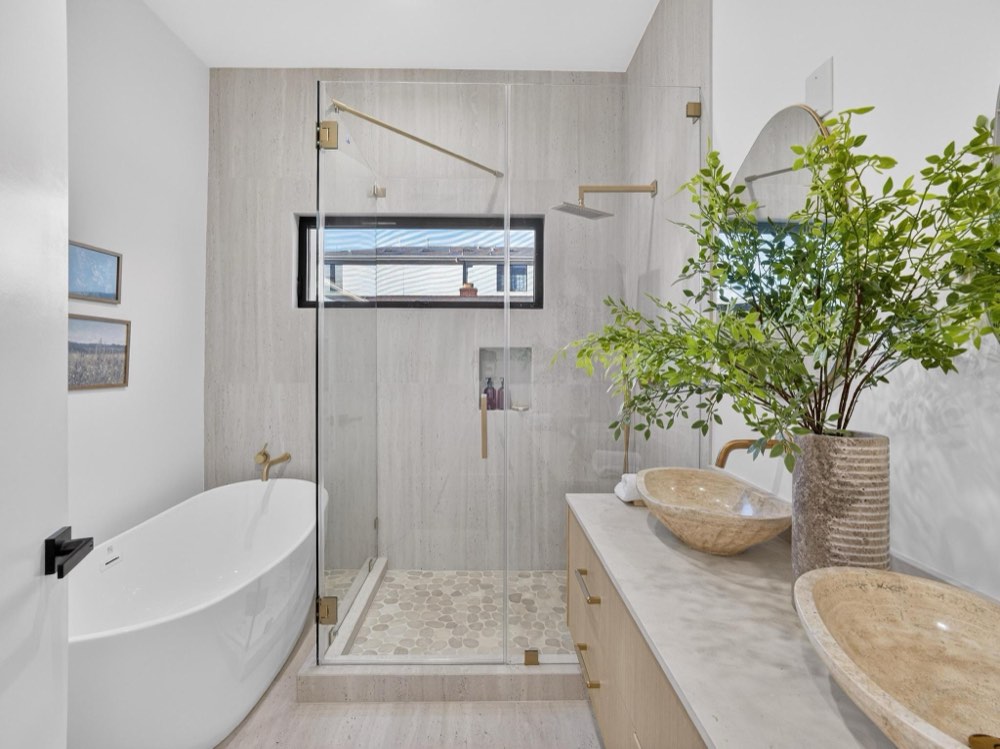 The Gonzaga Residence — primary bath with freestanding tub