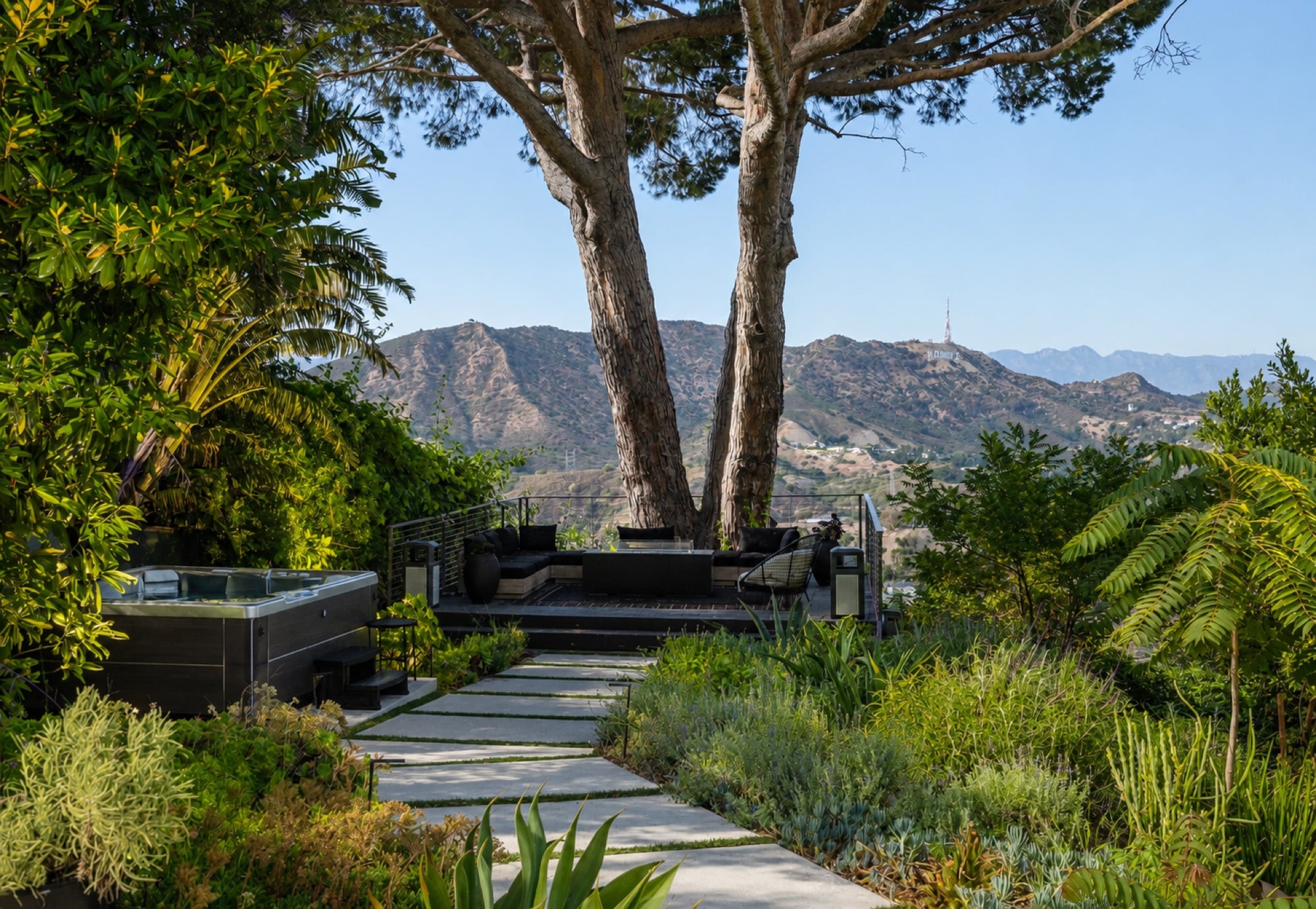 Terraced hillside garden and lounge deck with the Hollywood sign in the distance