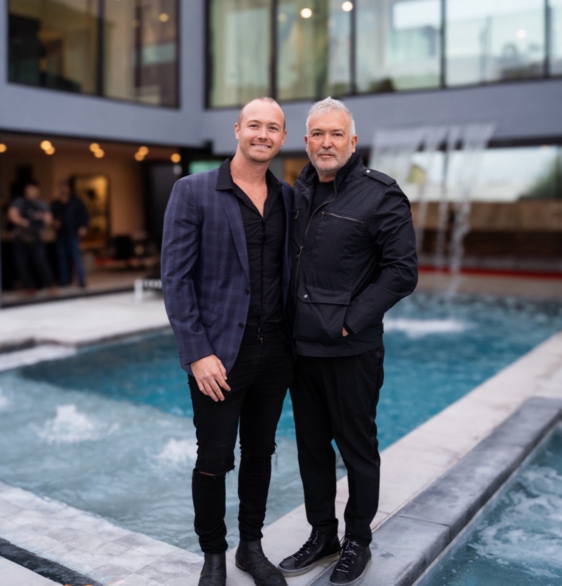 Oliver and RC Thornton beside the pool at a completed Thornton development